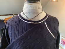 Cable knit navy sweater with white accents
