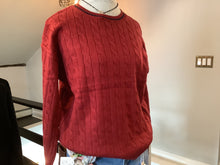Cable knit sweater in soft red with blue accents